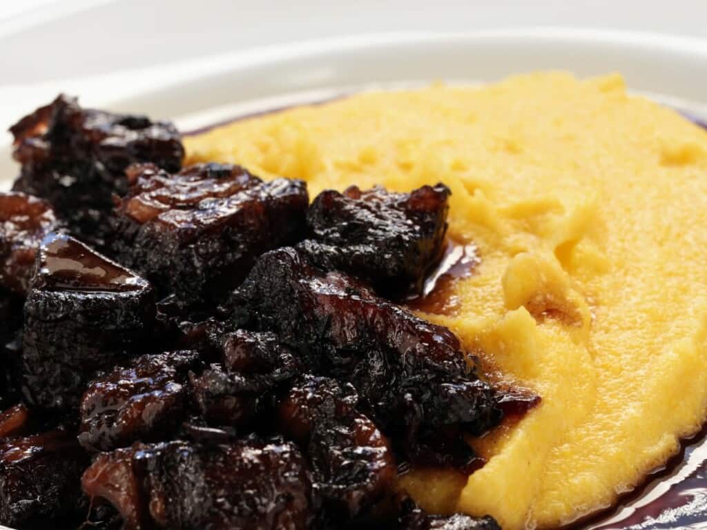 beef stew served with polenta zoomed in 