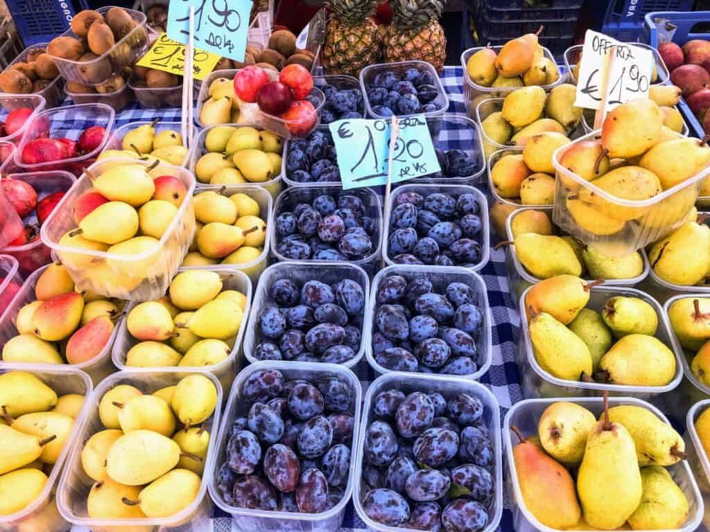 Summer fruit on display at an outdoor market in Florence, Italy.