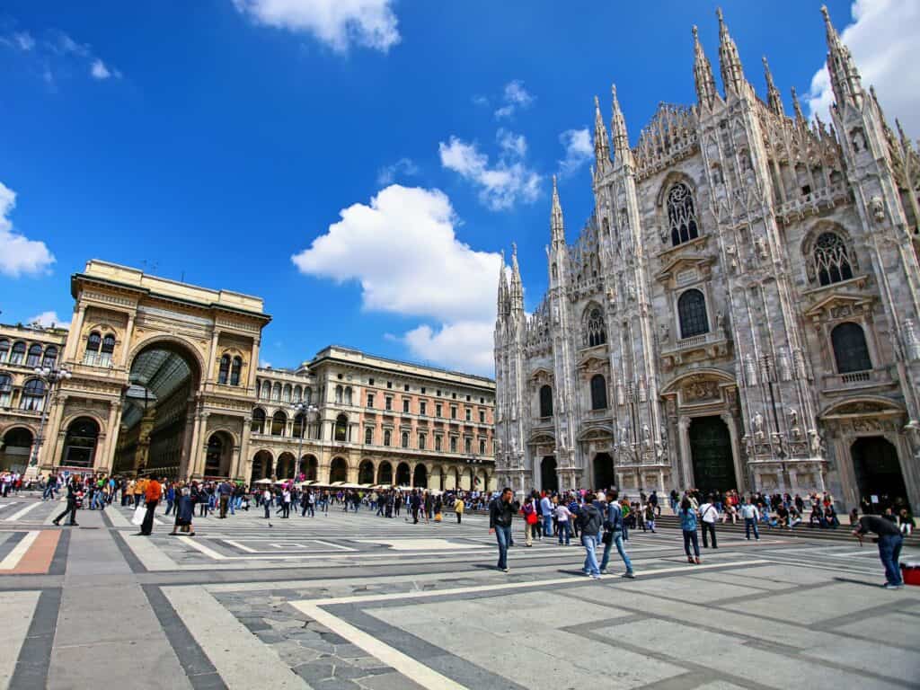 view of main piazza with cathedral on right side in milan