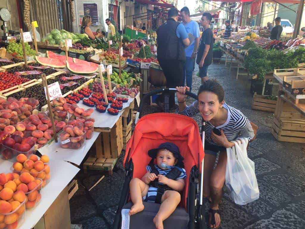 My son and I visiting the open air markets in Palermo