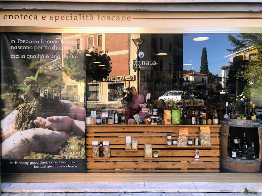 Front window of a gastronomia and wine shop in Italy.