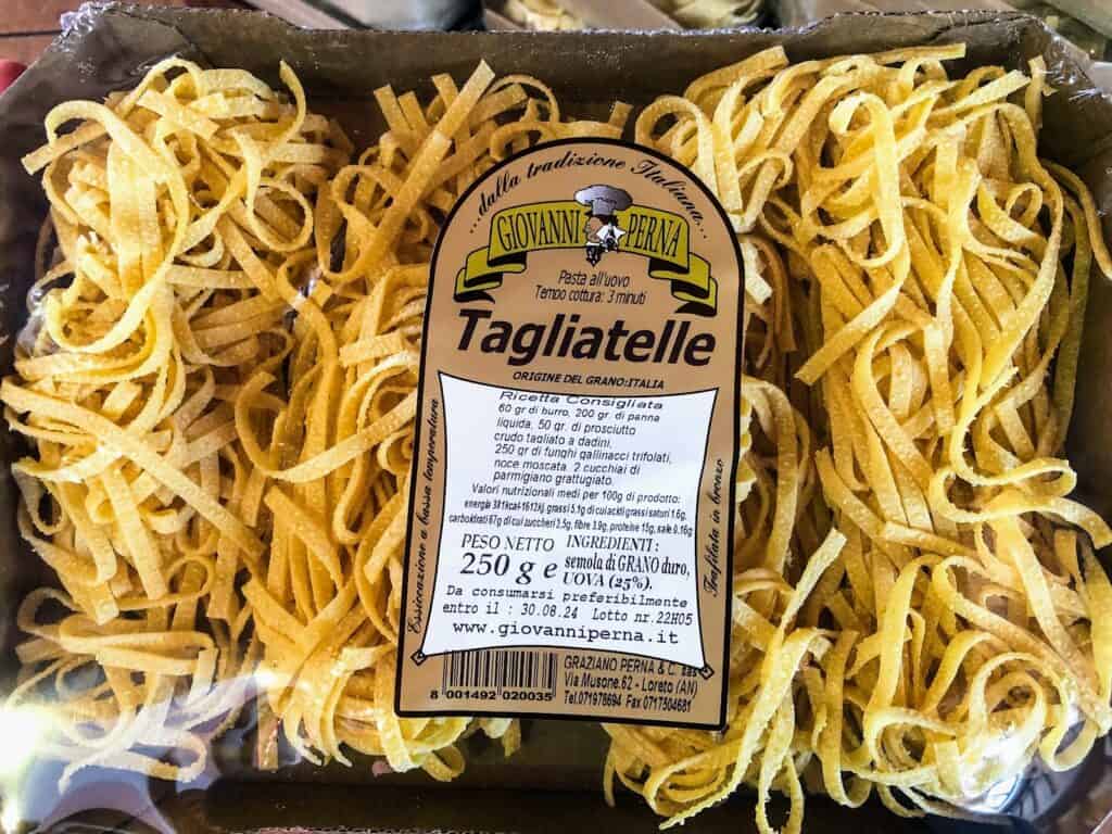 Close up of package of dried tagliatelle pasta.