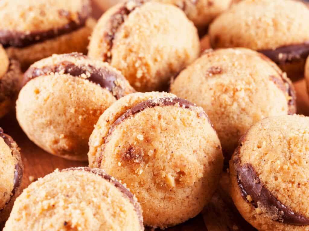 Close up of a pile of baci di dama Italian cookies.