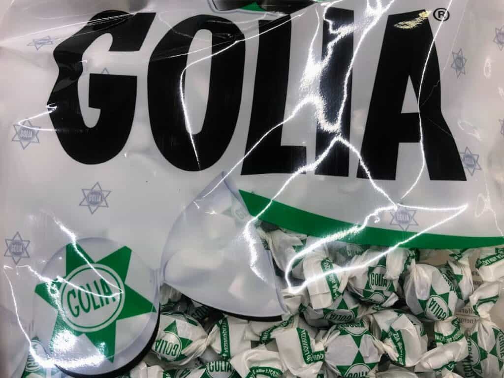 Close up of white and green package of Golia Italian candy.