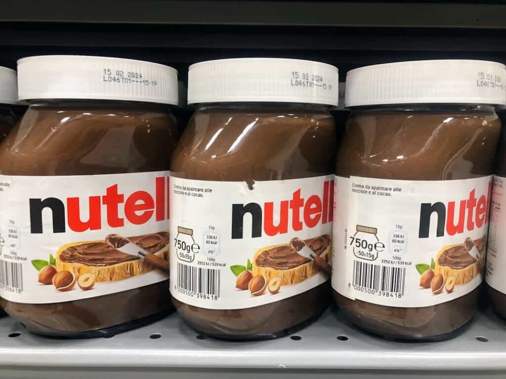 Large jars of Nutella on the grocery store shelf in Italy.