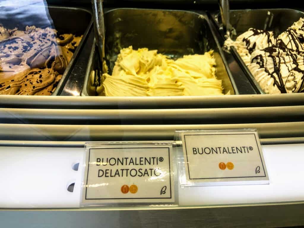Metal bins of Buontalenti gelato at a gelateria in Florence, Italy.