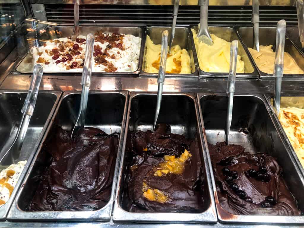Metal bins of gelato at a gelateria in Italy.