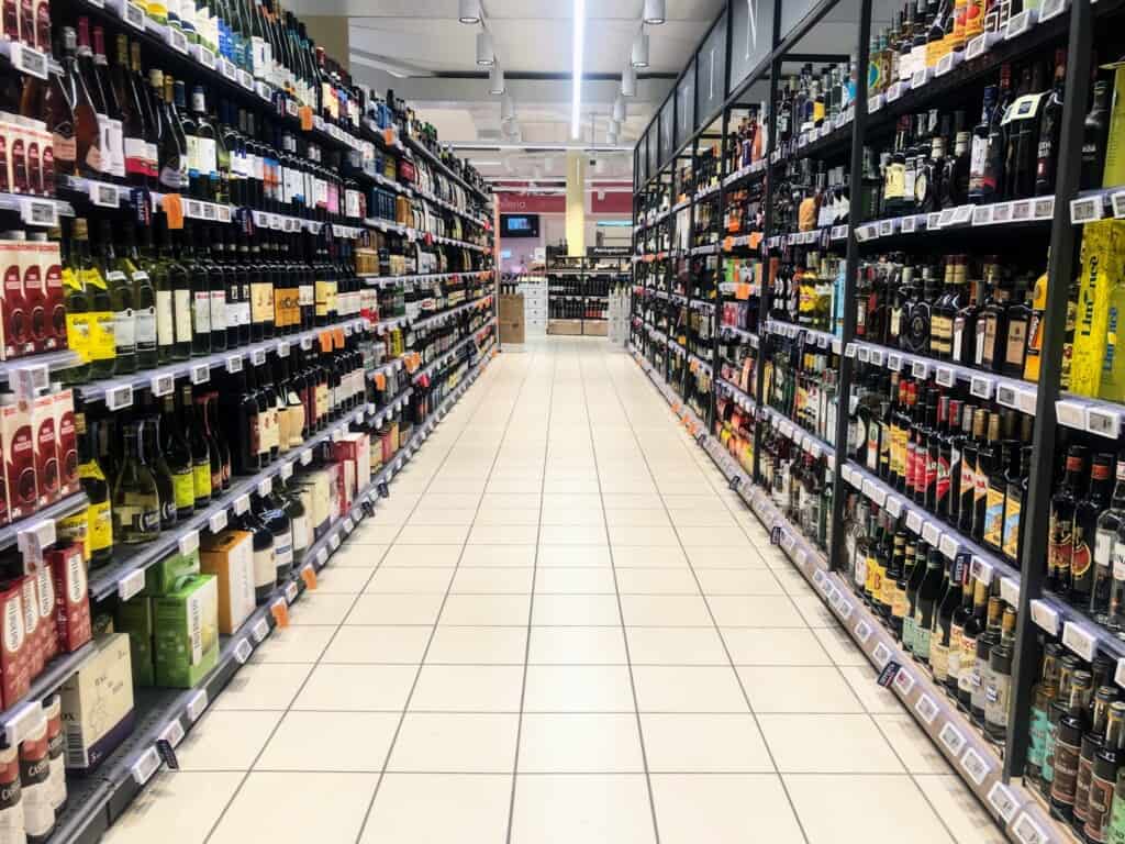 View of wine and spirits aisle in an Italian supermarket.