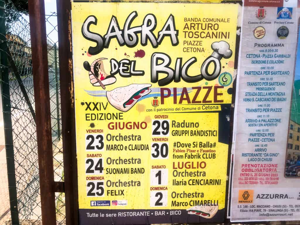 Yellow poster for a sagra in Italy. It's attached to a chain link fence.
