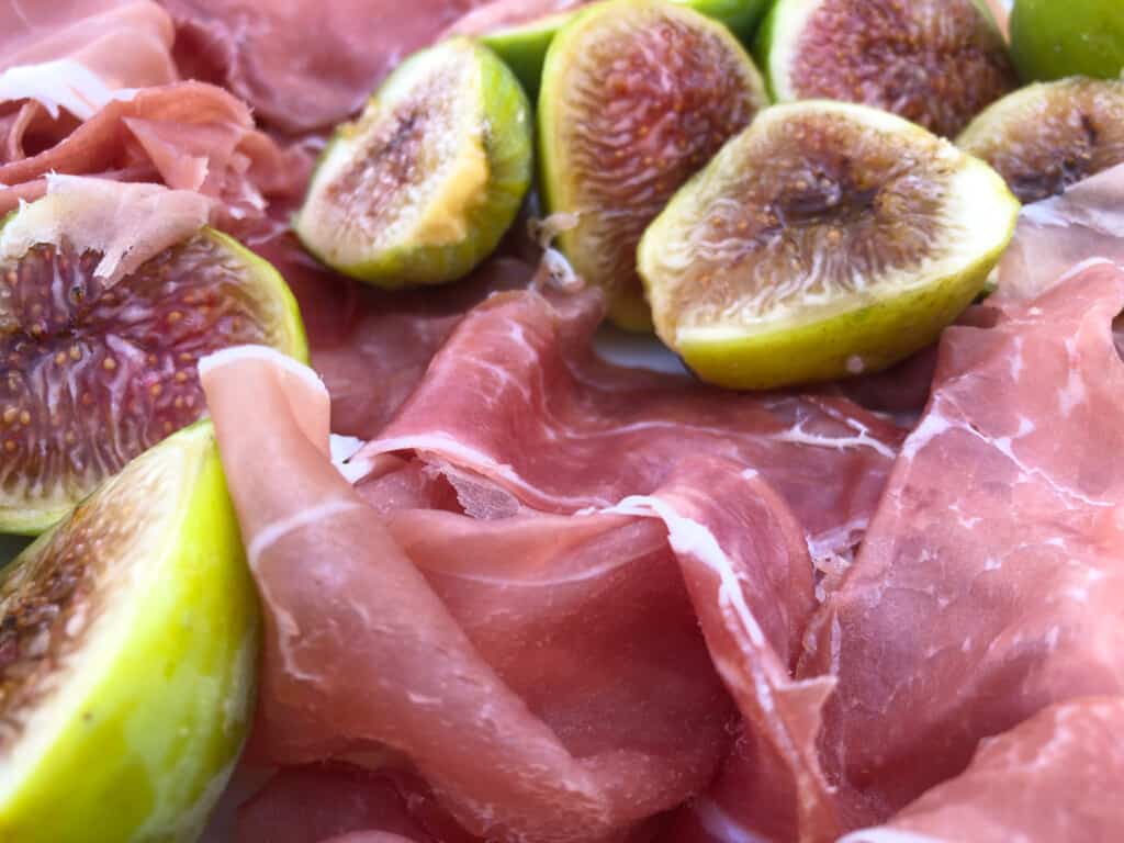 close up of prosciutto and figs.