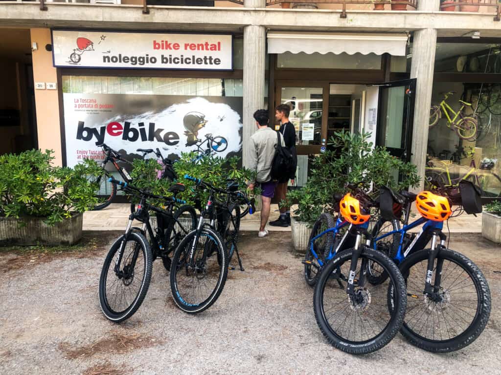E-bikes and normal bikes outside a bike shop in Montepulciano, Italy.