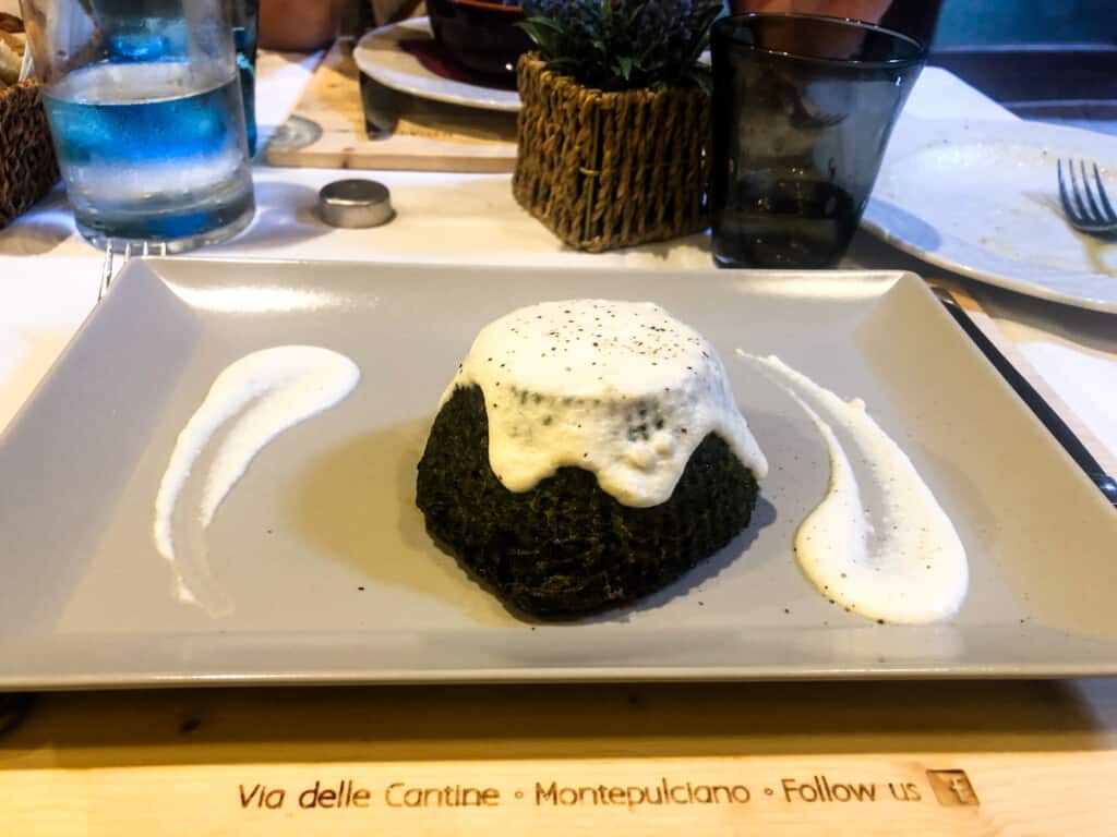 Vegetable and cheese appetizer on a plate in a restaurant in Italy.