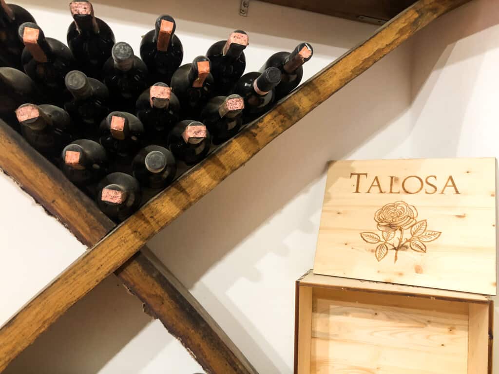 Wine bottles stacked at Talosa Winery.