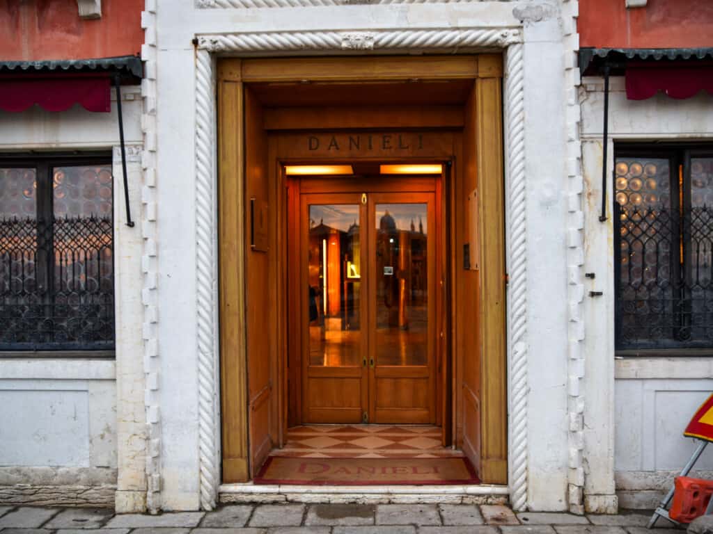 Wooden and glass front door at Danieli in Venice, Italy.