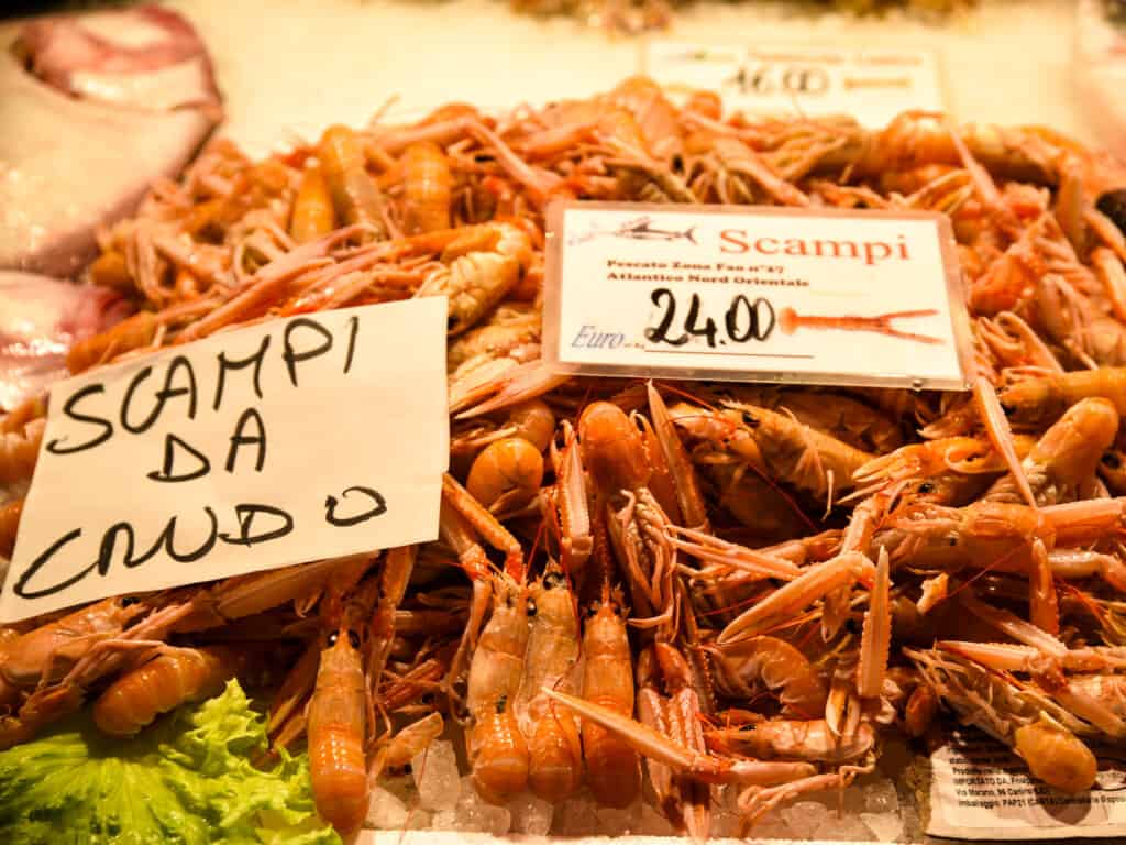 Freshly-caught scampi with prices at the Rialto Market in Venice, Italy.