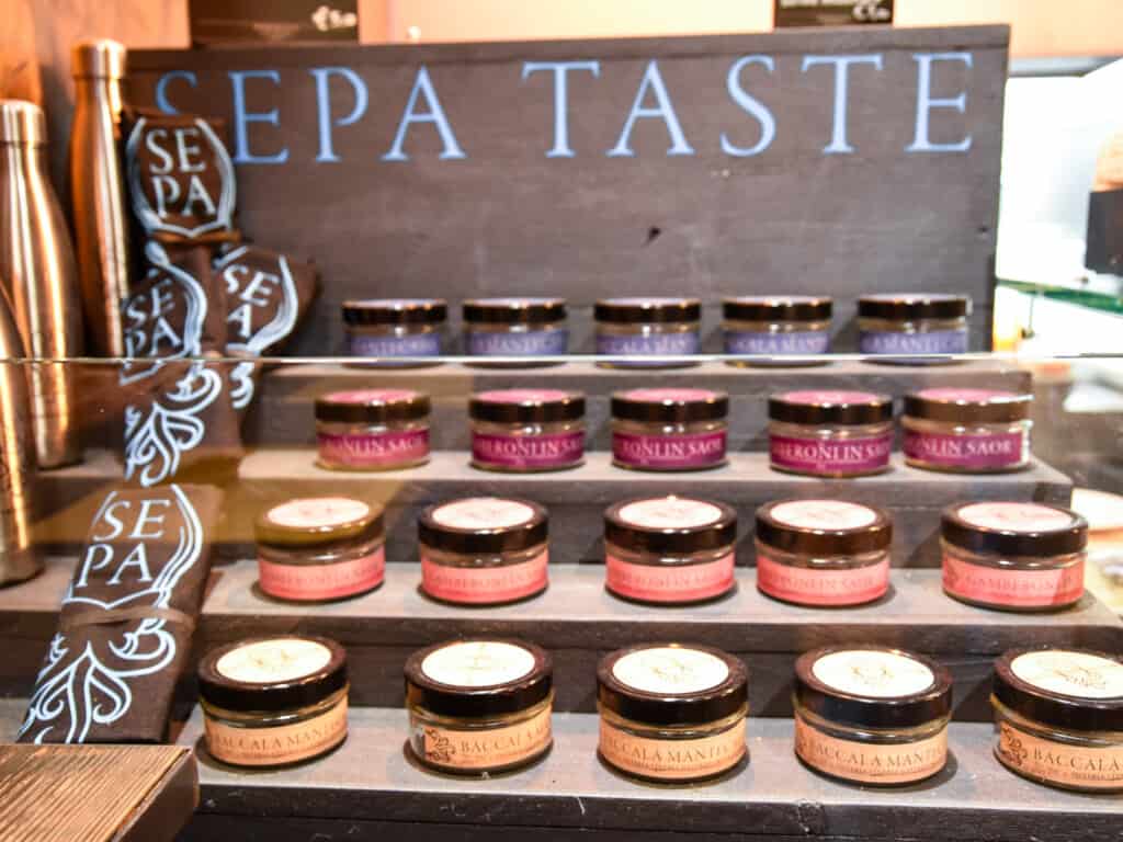 Cicchetti spreads in jars for sale at SEPA in Venice, Italy.