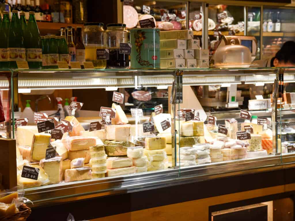 Glass display of cheeses in Venice, Italy.