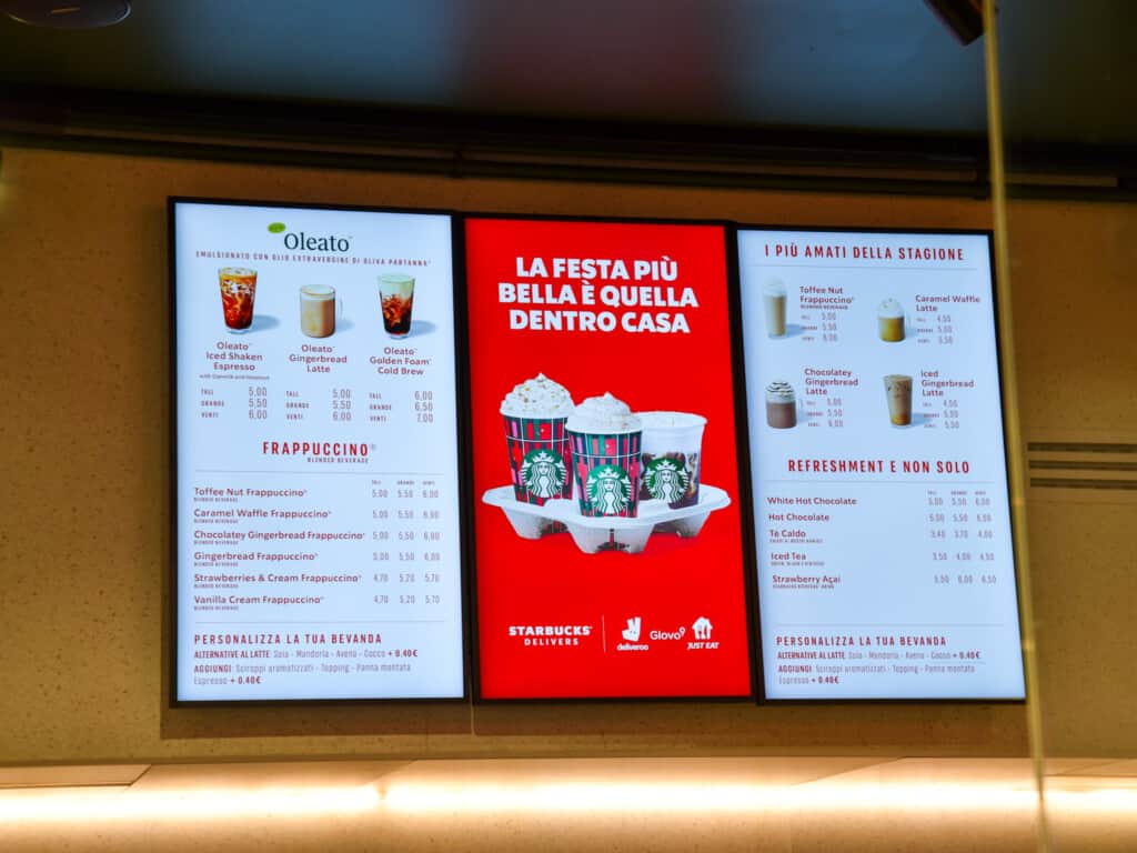 Digital menu on wall at Starbucks in Italy.