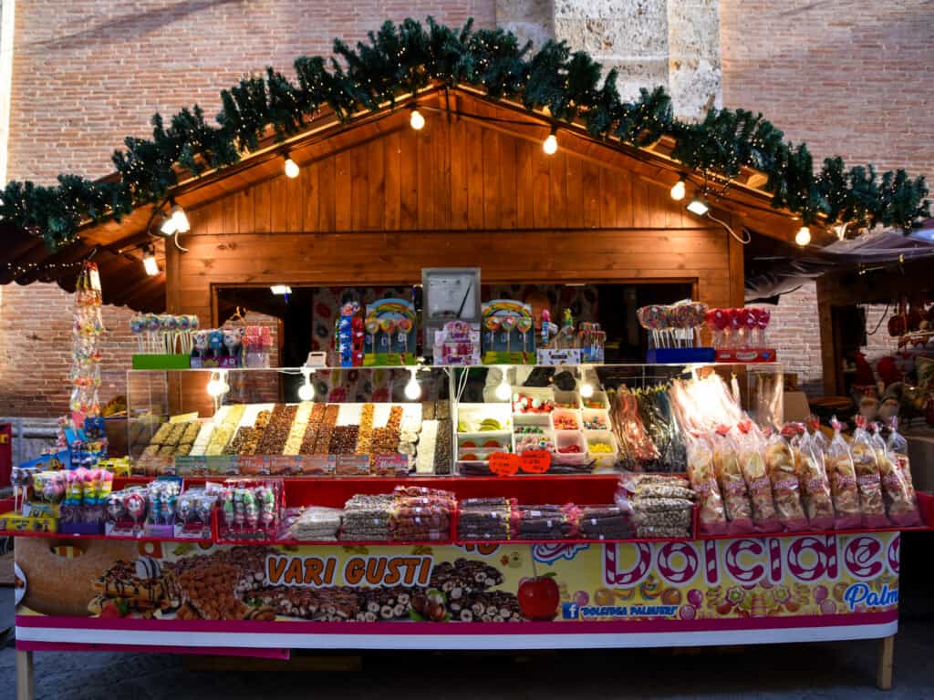 Candy and nuts on display in a wooden stall at the Christmas Market in Montepulciano.